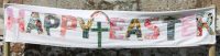 Cloth banner with happy Easter, rainbow and cross in fabric
